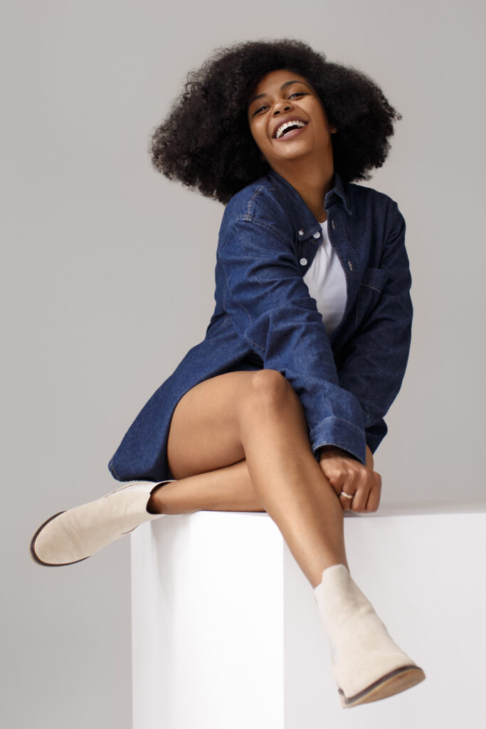 full shot woman with afro hairstyle
